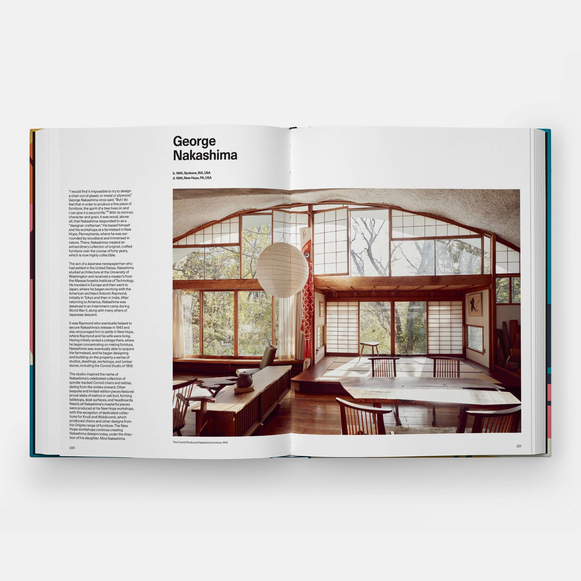 Open book showing a interior design layout with wooden furniture and large windows.