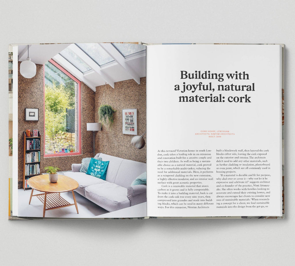 Open book showing a living room with cork walls and a quote about building with cork.
