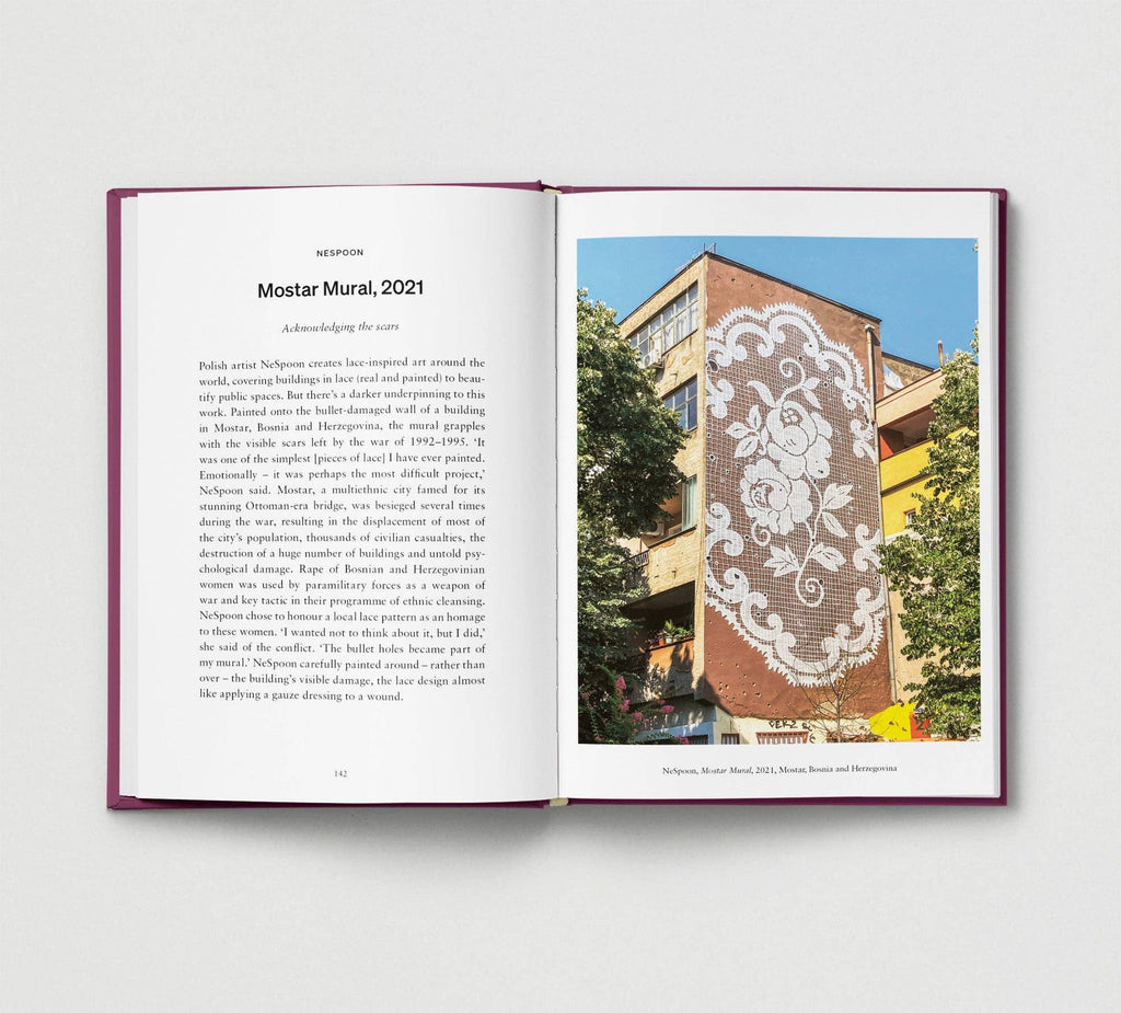 Open book showing text and an image of a mural on a building