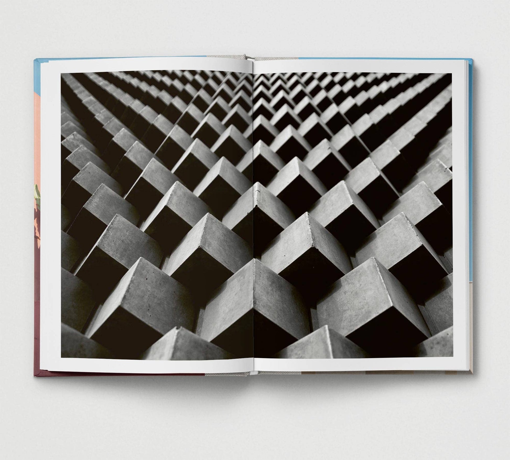 Open book showing a black and white geometric pattern