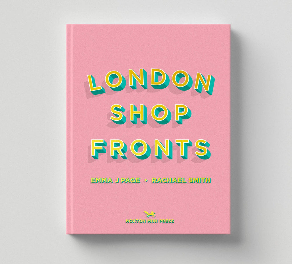Book titled 'London Shop Fronts' with colorful text on a pink cover against a gray background