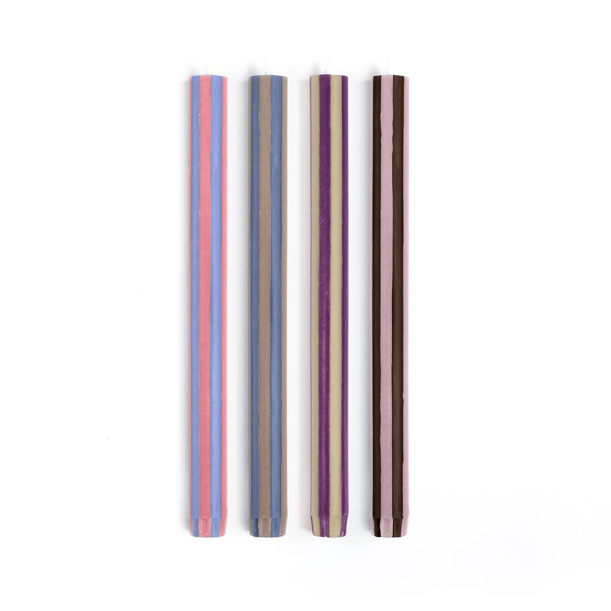 Four striped straws in different colors on a white background