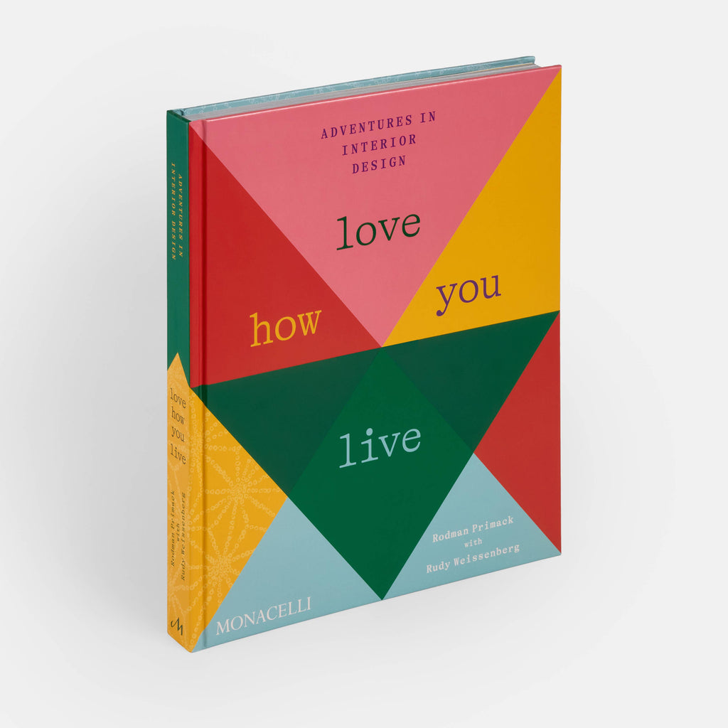 Book titled 'Adventures in Interior Design: Love How You Live' with geometric color pattern on cover
