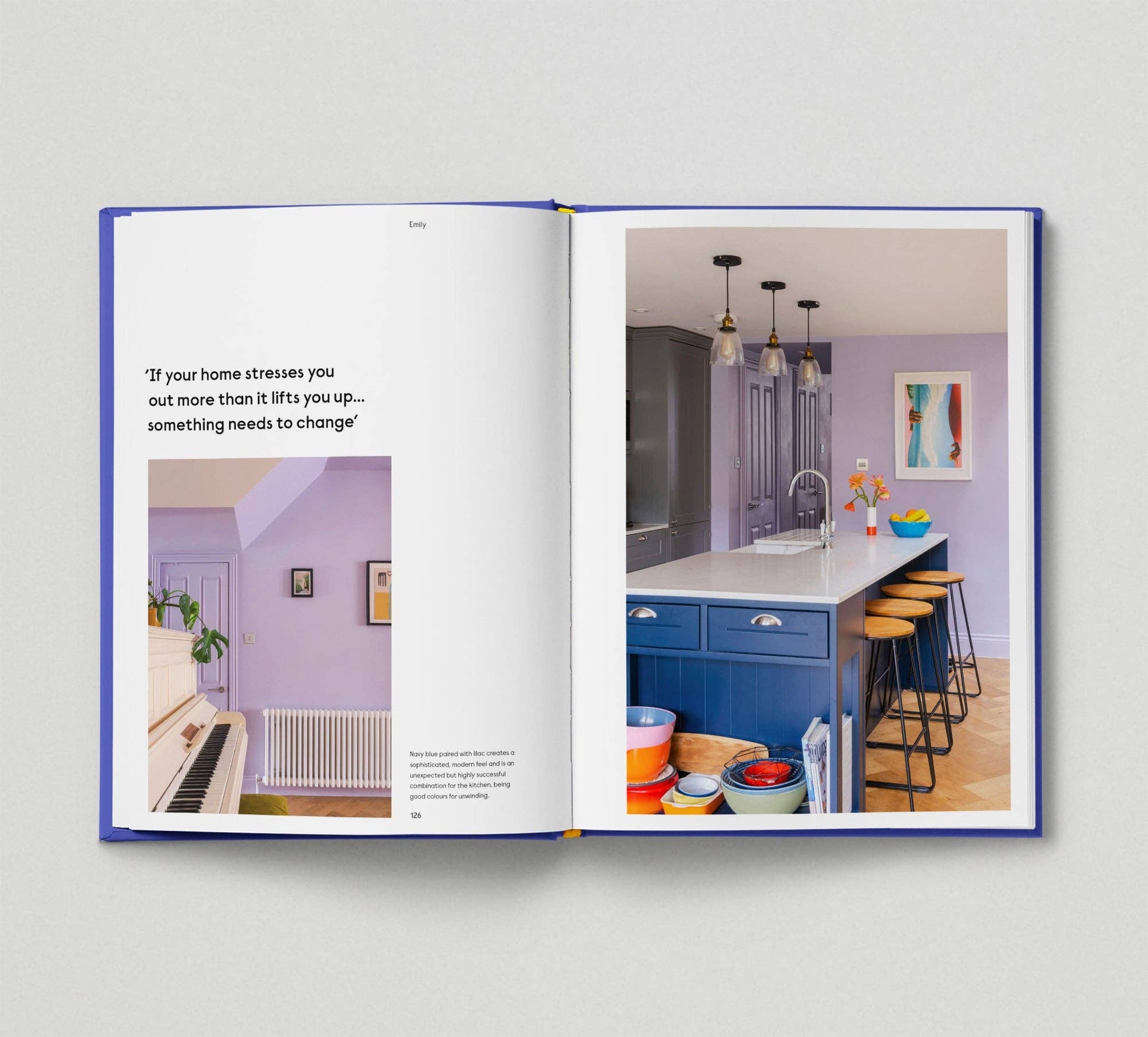 Open book showing a kitchen interior with colorful decor and text.