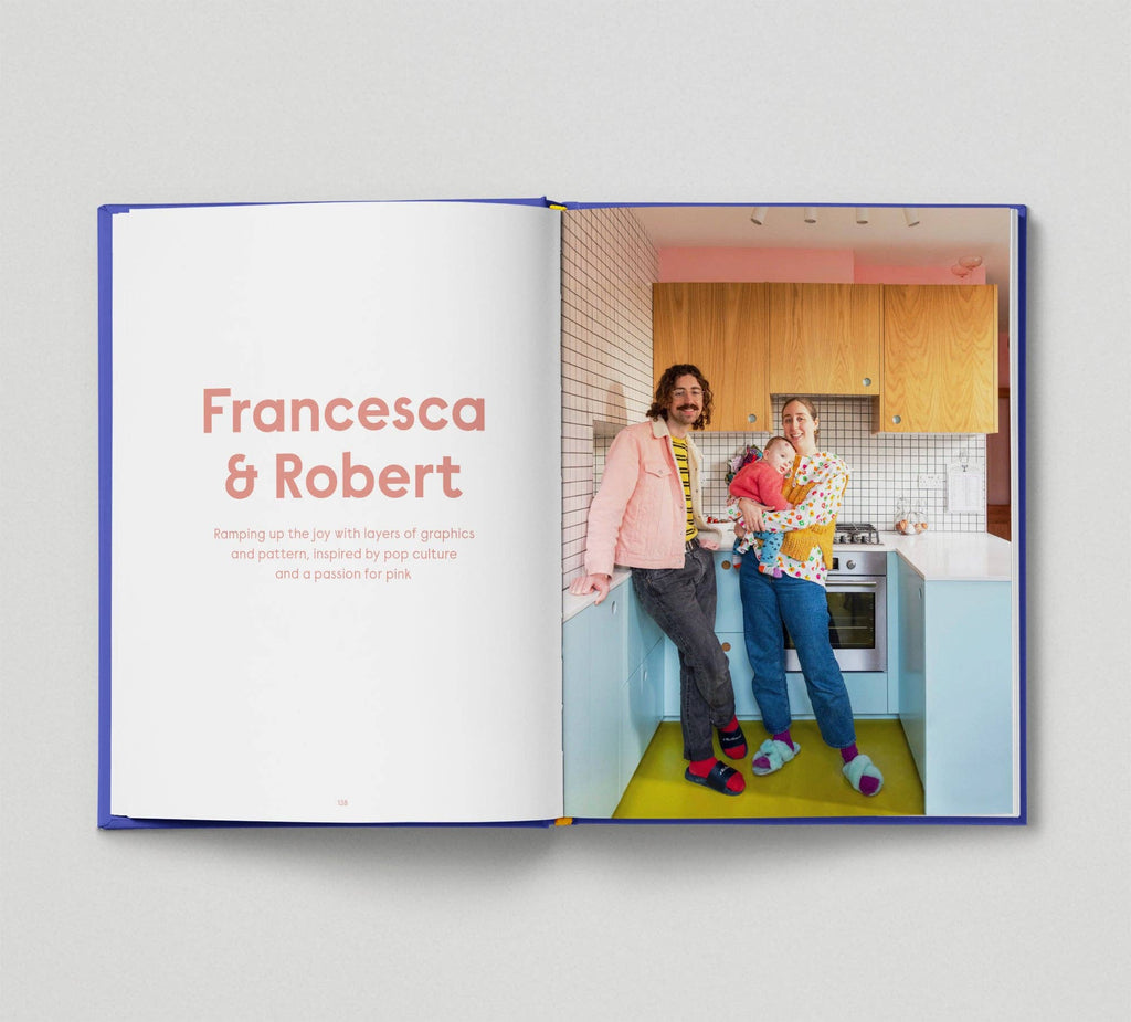 Open book showing a family in a kitchen with 'Francesca & Robert' text.