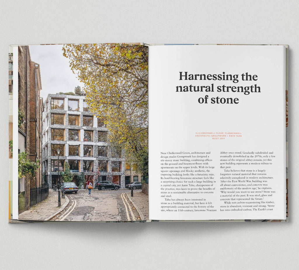 Open book showing a street scene with a building and text on stone architecture.