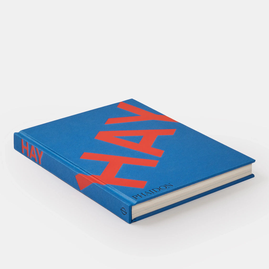 Blue book with red 'HAY' logo on a white background
