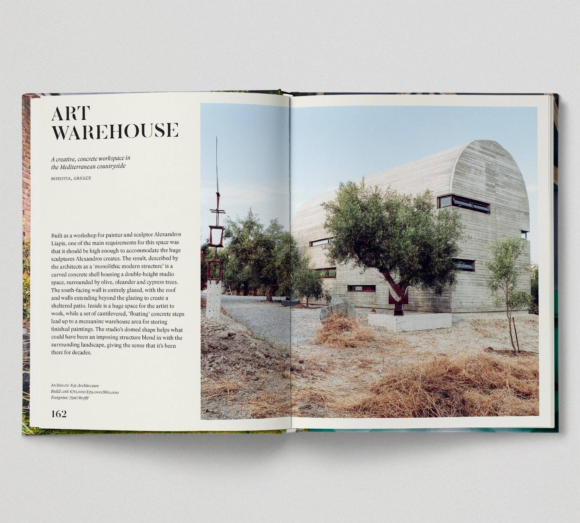 Open book showing an architectural photograph of a building with text on a white background