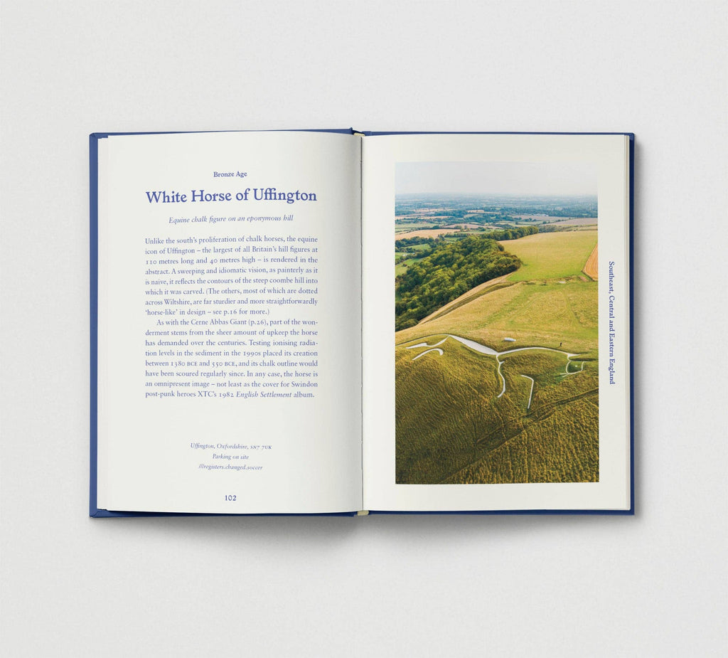 Open book showing an aerial view of the White Horse of Uffington on a white background