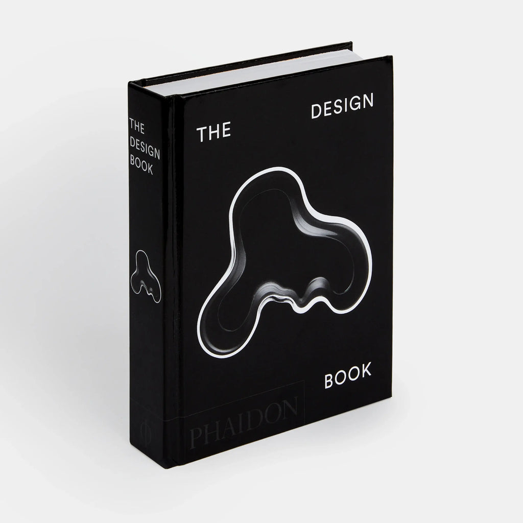 Black book titled 'The Design Book' by Phaidon on a white background