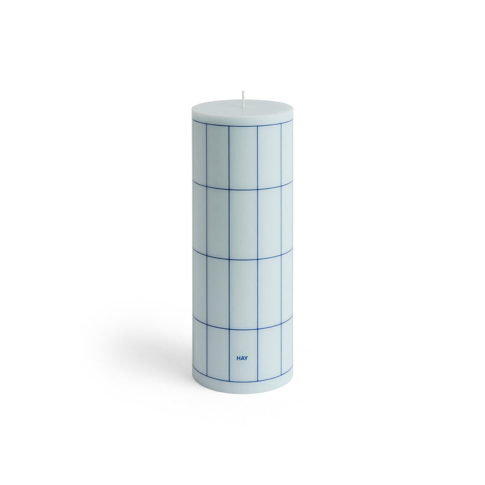 Cylindrical candle with grid pattern on a white background