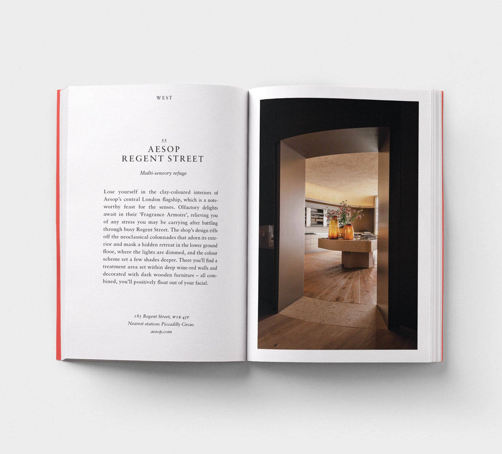 Open book with interior design text and a photograph of a room.