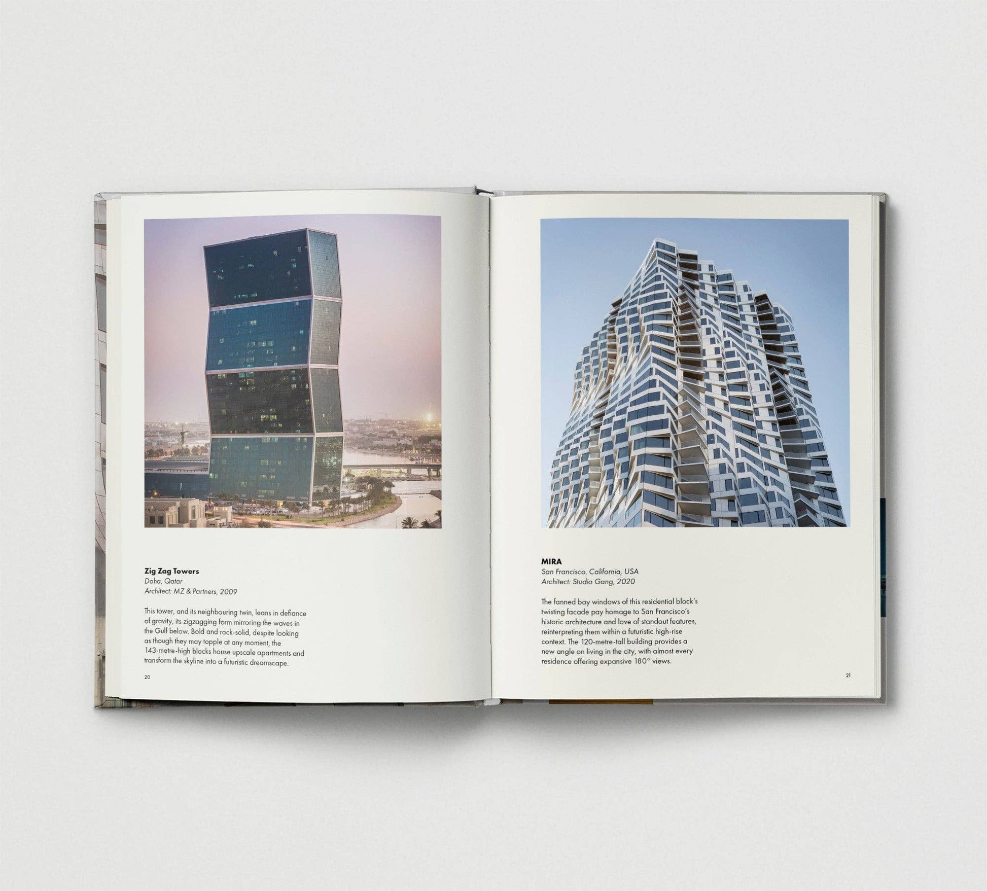 Open book showing images of modern buildings