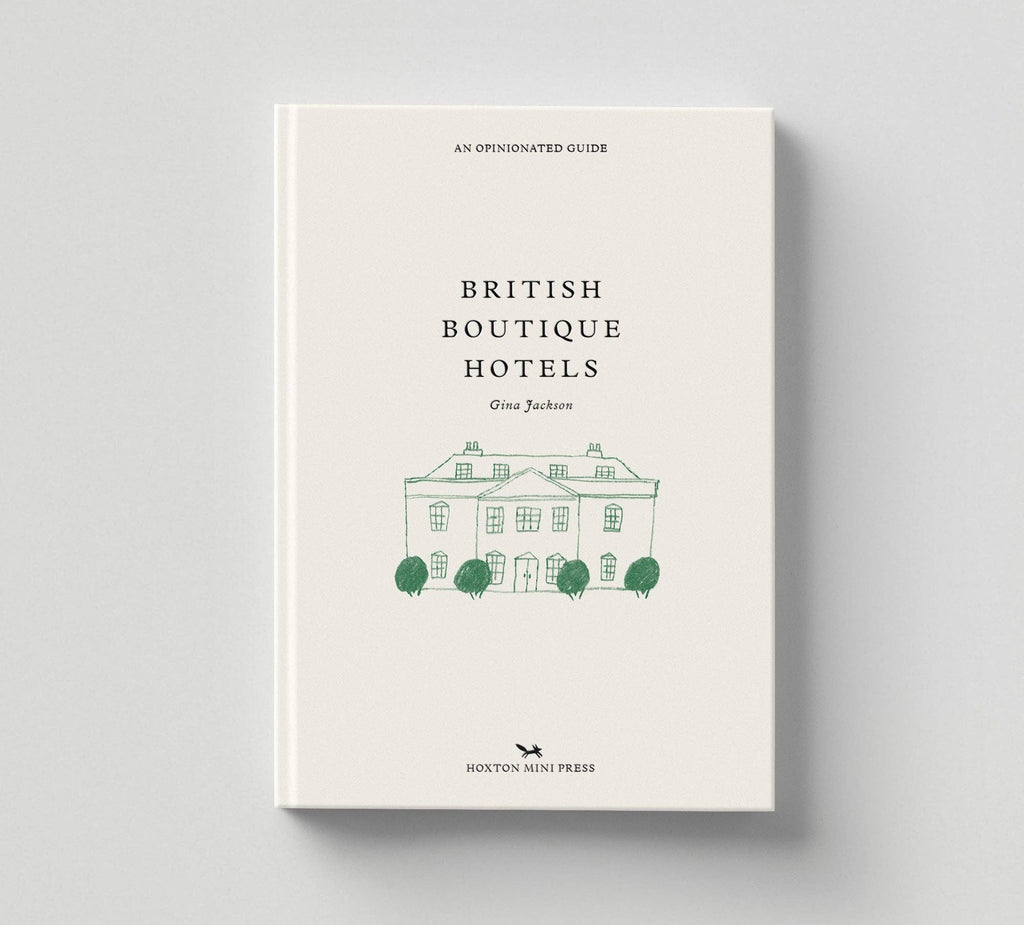 Book titled 'British Boutique Hotels' with a white cover and green text on a gray background