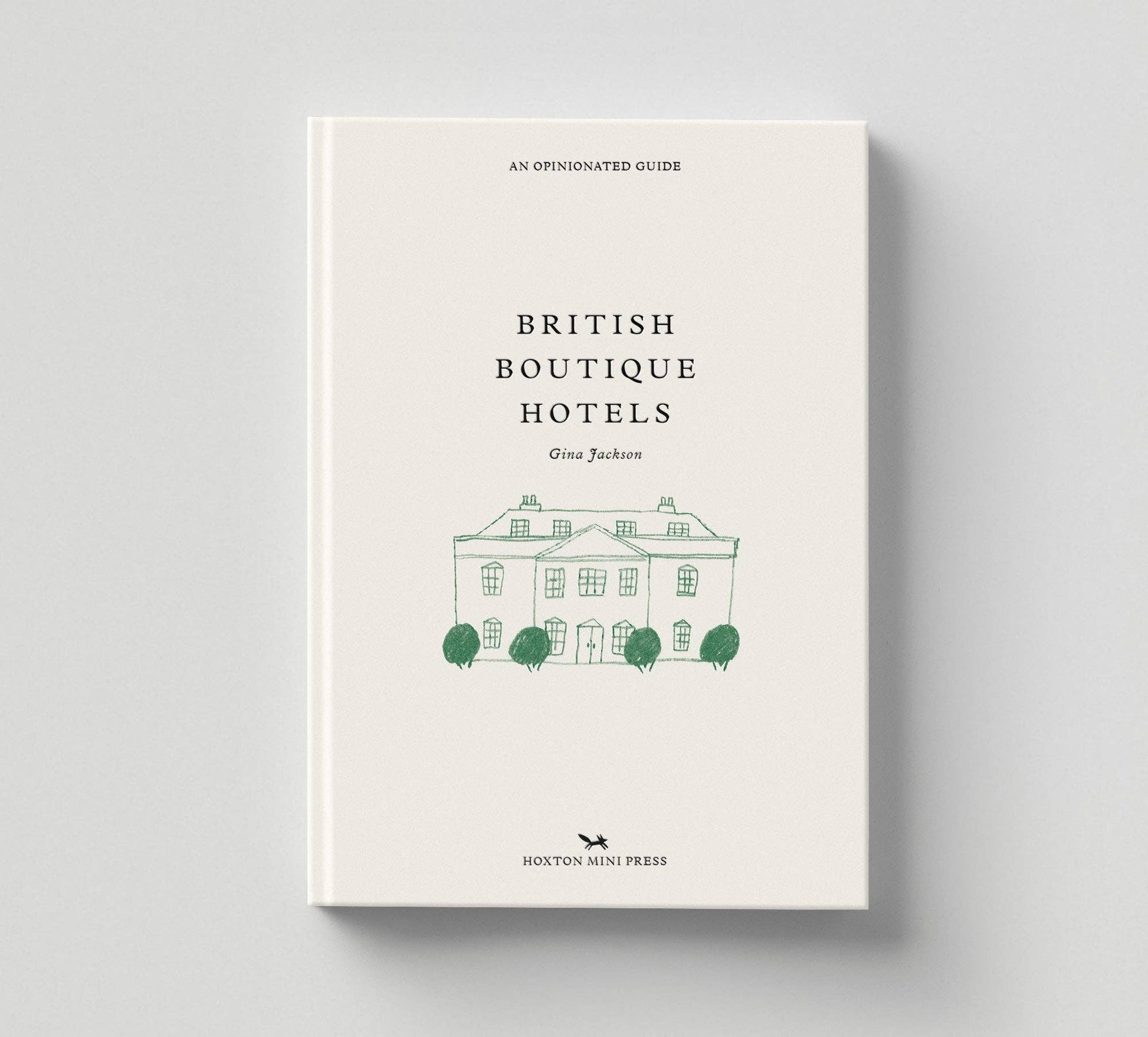 Book titled 'British Boutique Hotels' with a white cover and green text on a gray background