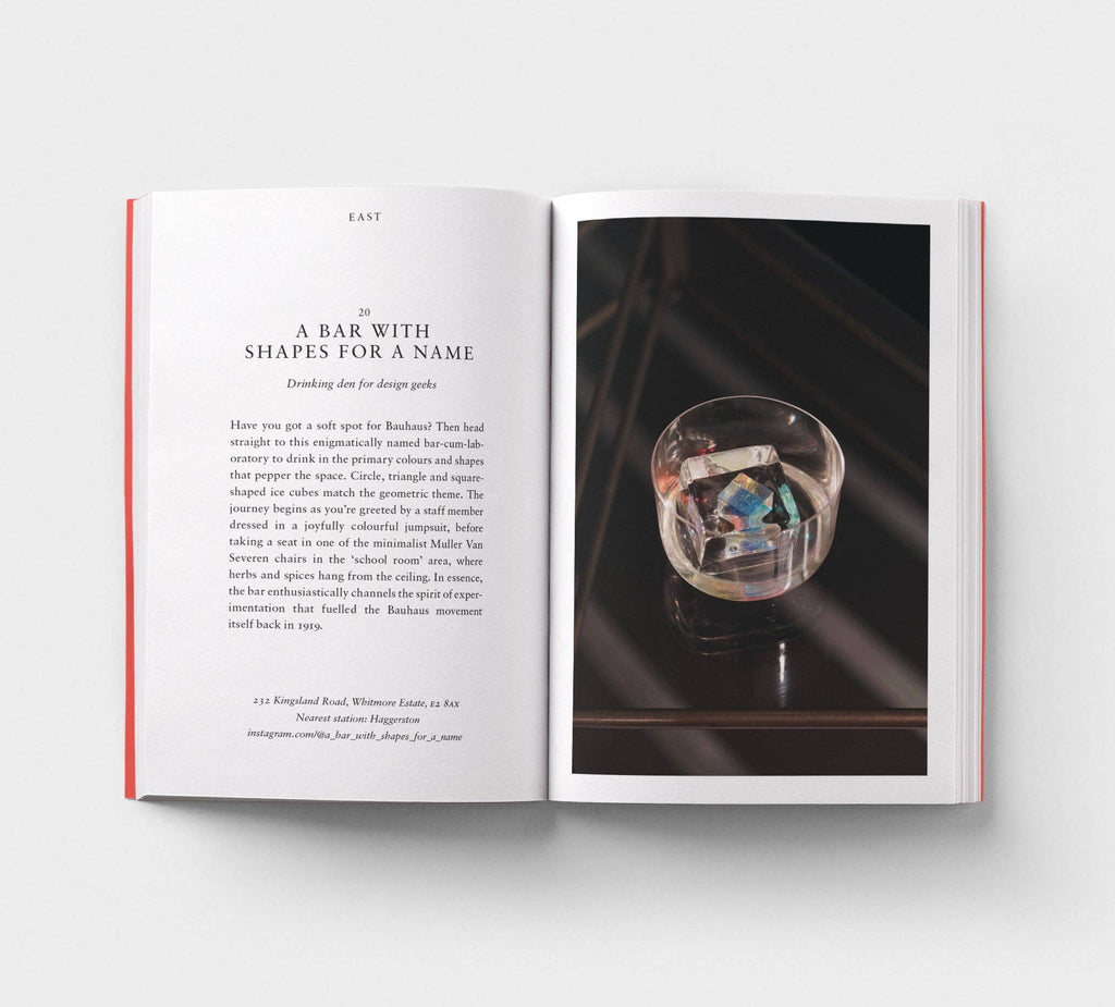 Open book with text and a photograph of a crystal ball on a white background