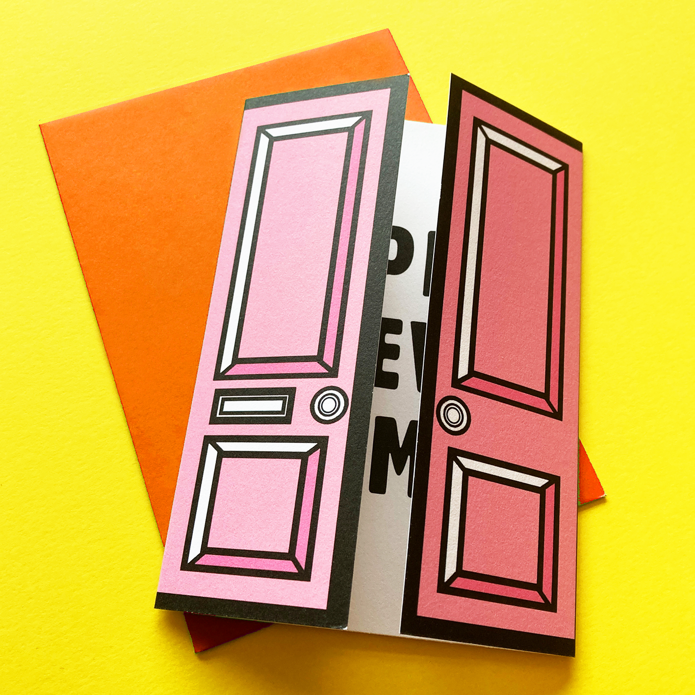 Pink greetings card with front door, on yellow background