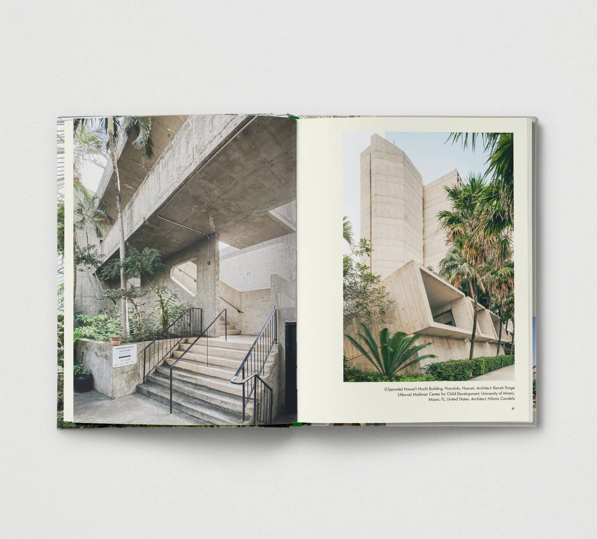 Open book showing architectural images of a building with concrete structure and greenery.