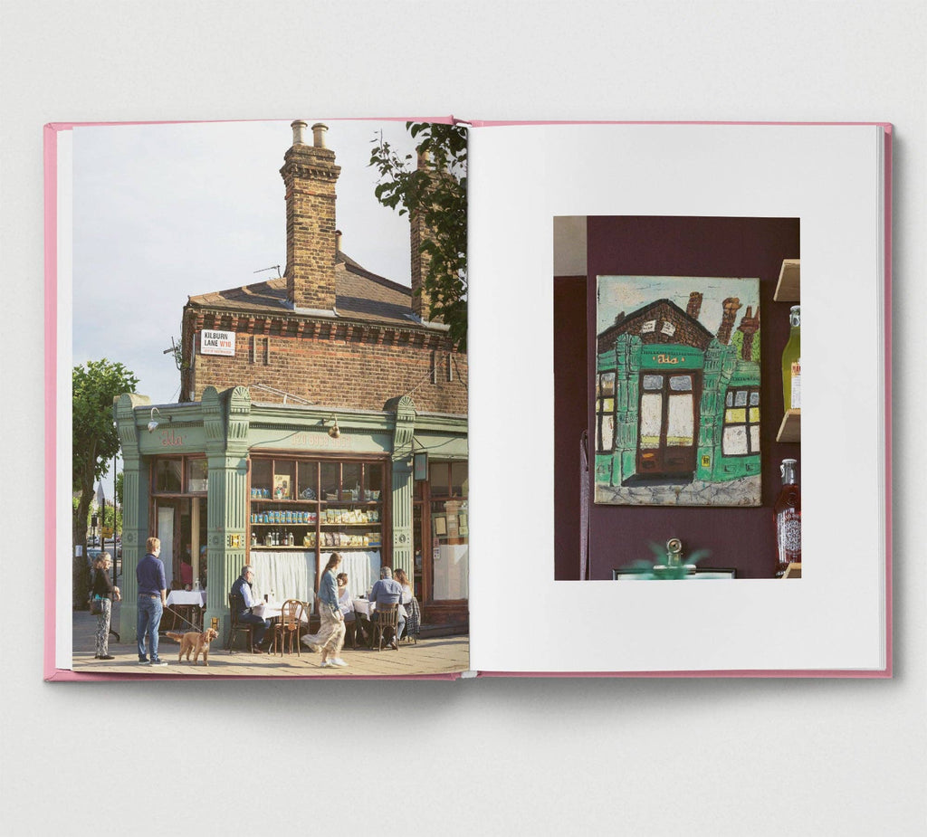 Open book showing a street scene with people and a building, with a close-up of a window on the right.