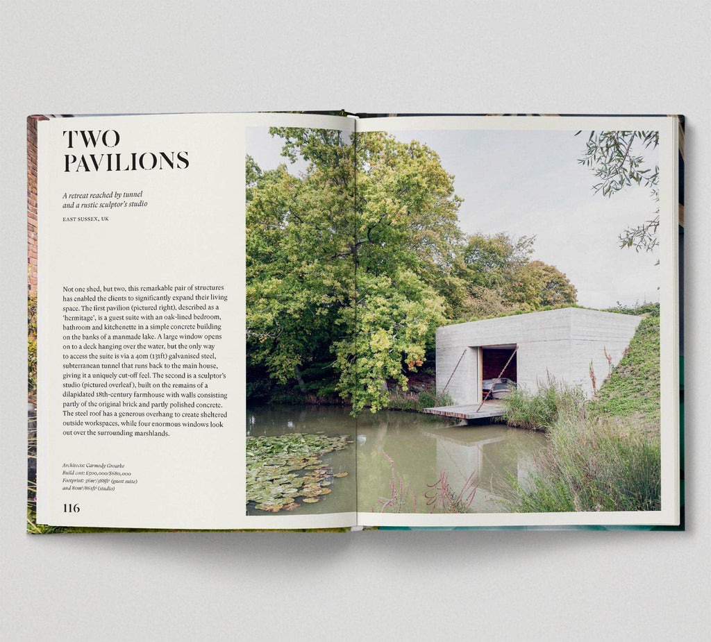 Open book showing a photograph of a modern building by a pond with trees in the background.