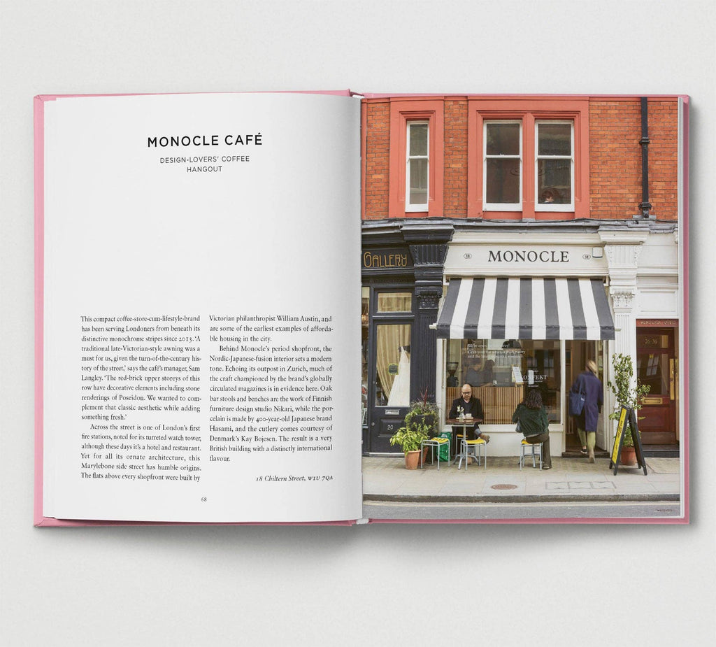 Open book showing a photograph of a café with 'Monocle' branding.
