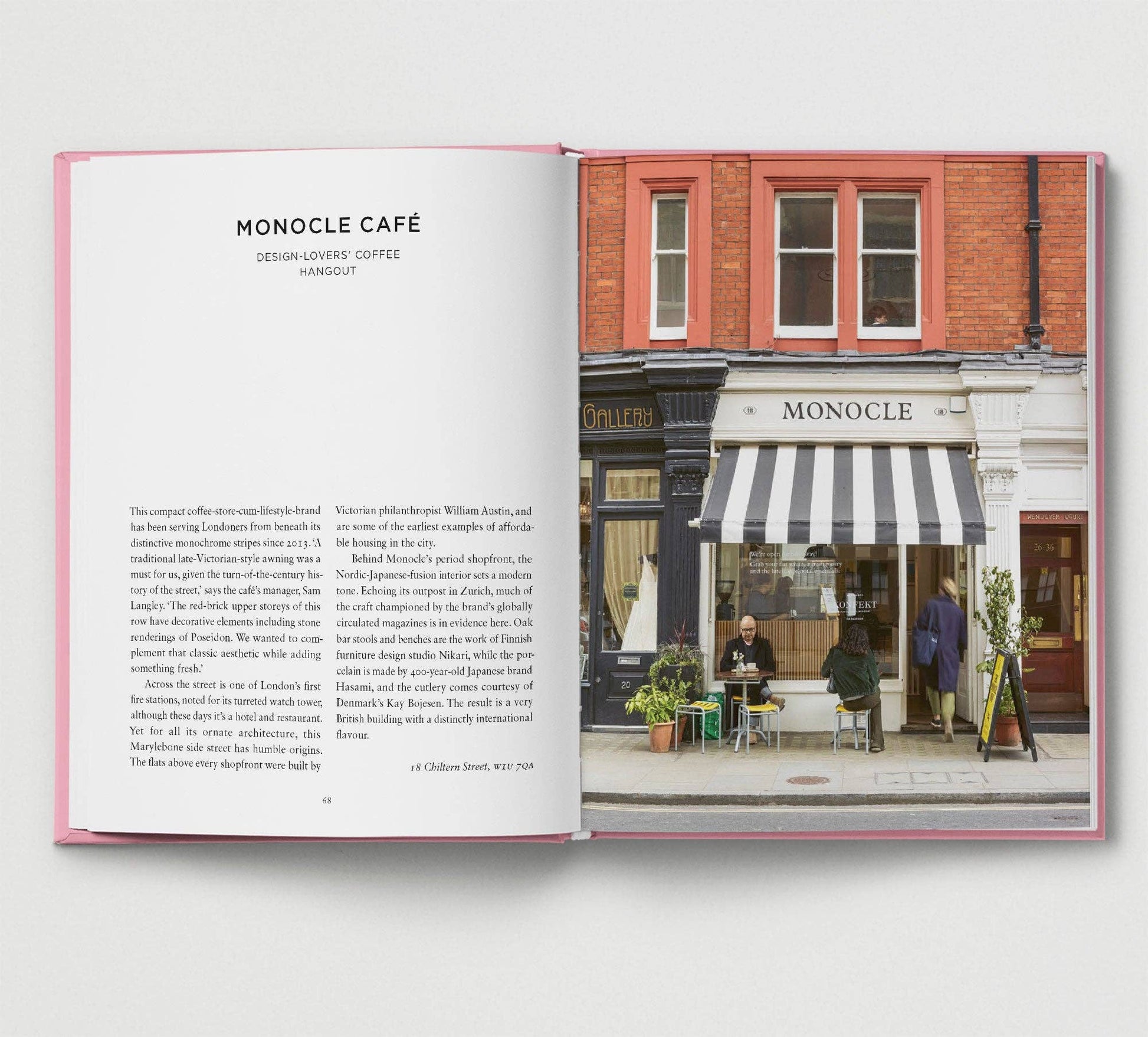 Open book showing a photograph of a café with 'Monocle' branding.