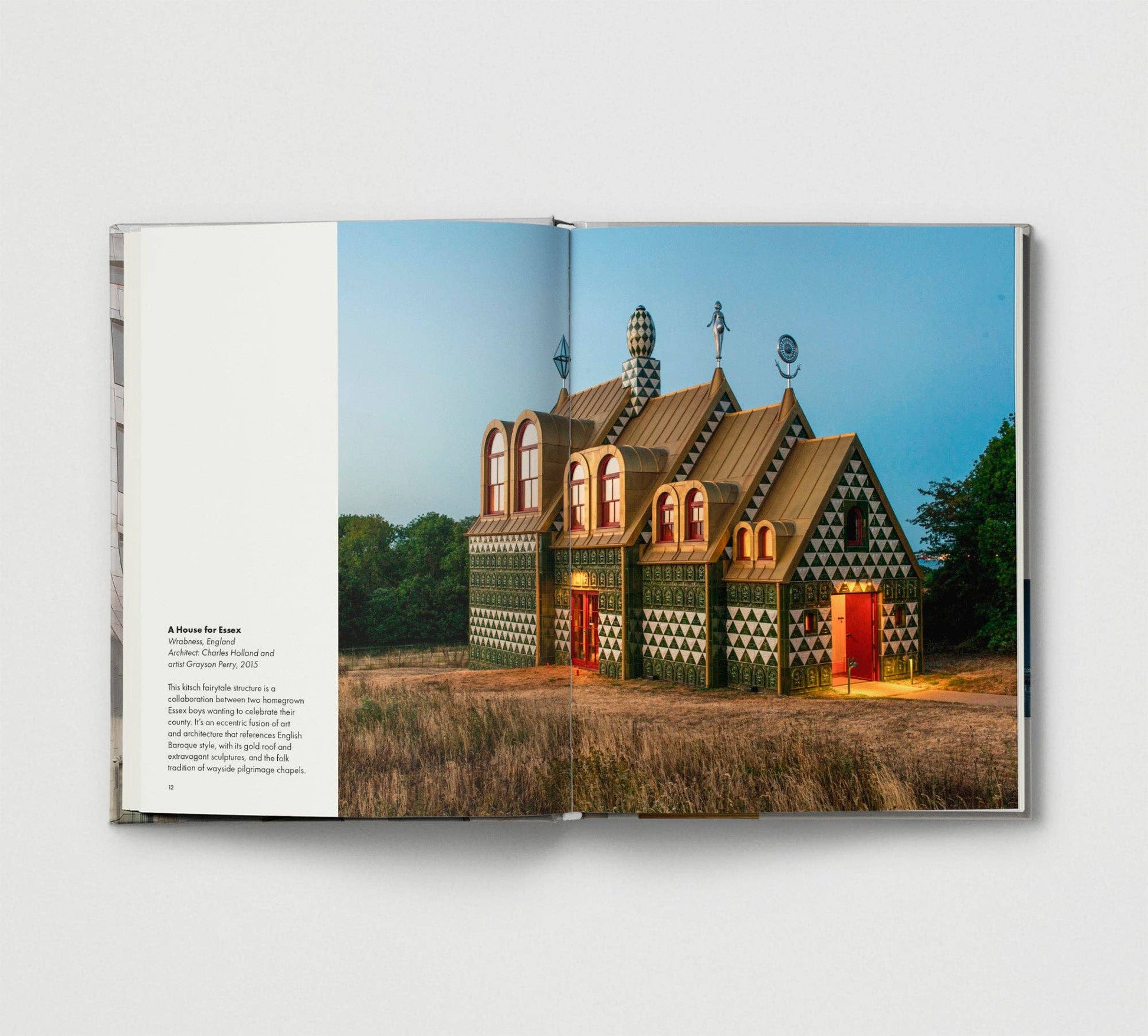 Open book showing a photograph of a unique building with geometric design on a white background