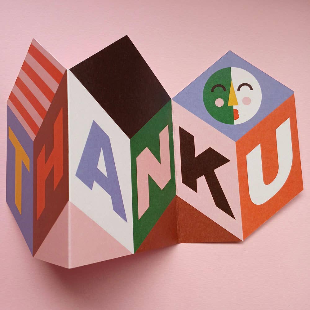 Foldable thank you card on pink background