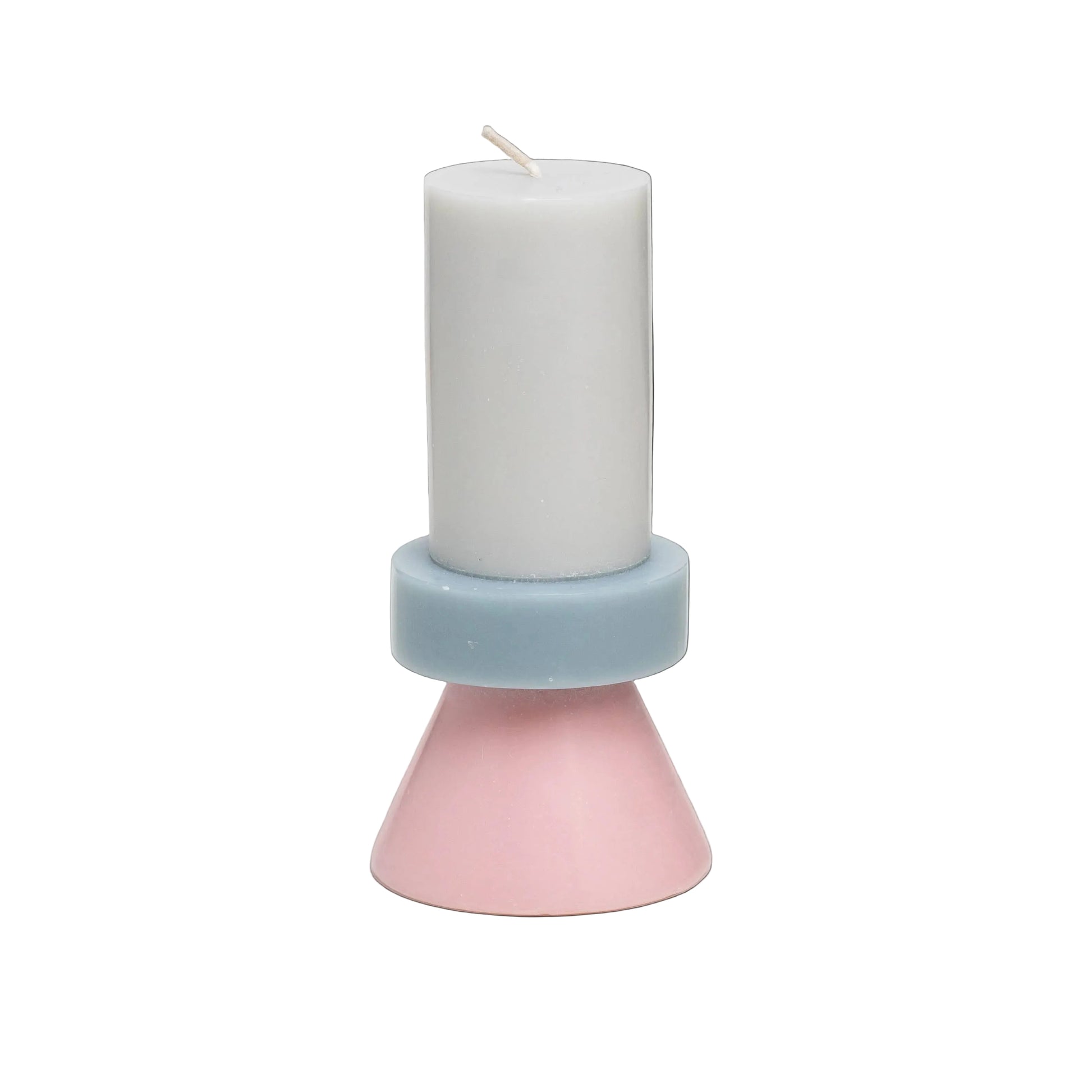 Candle in a pink and blue holder on a white background