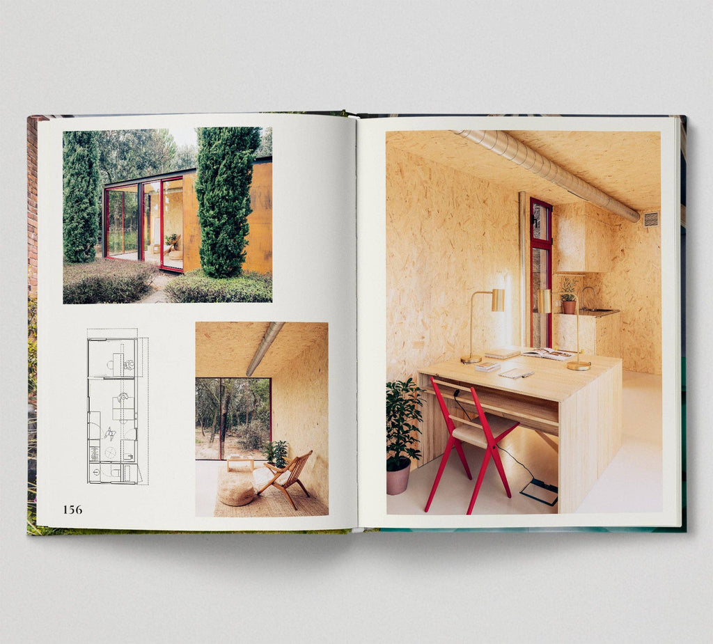 Open book showing interior design images of a modern home.