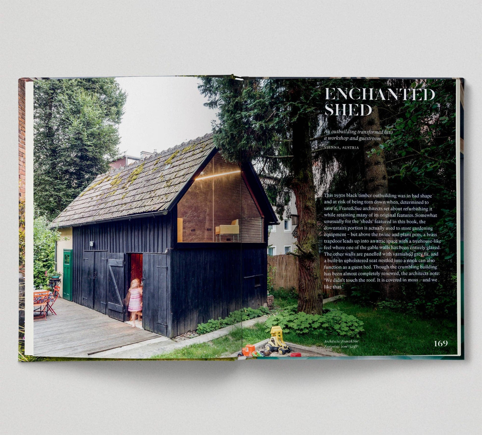 Book open to a page featuring an image of a wooden shed with text 'Enchanted Shed'.