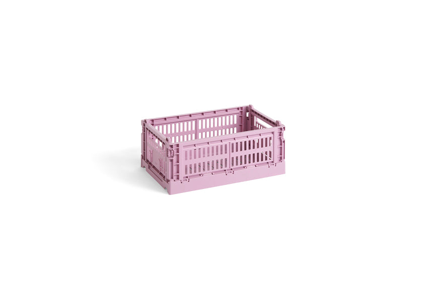 Pink plastic crate on a white background