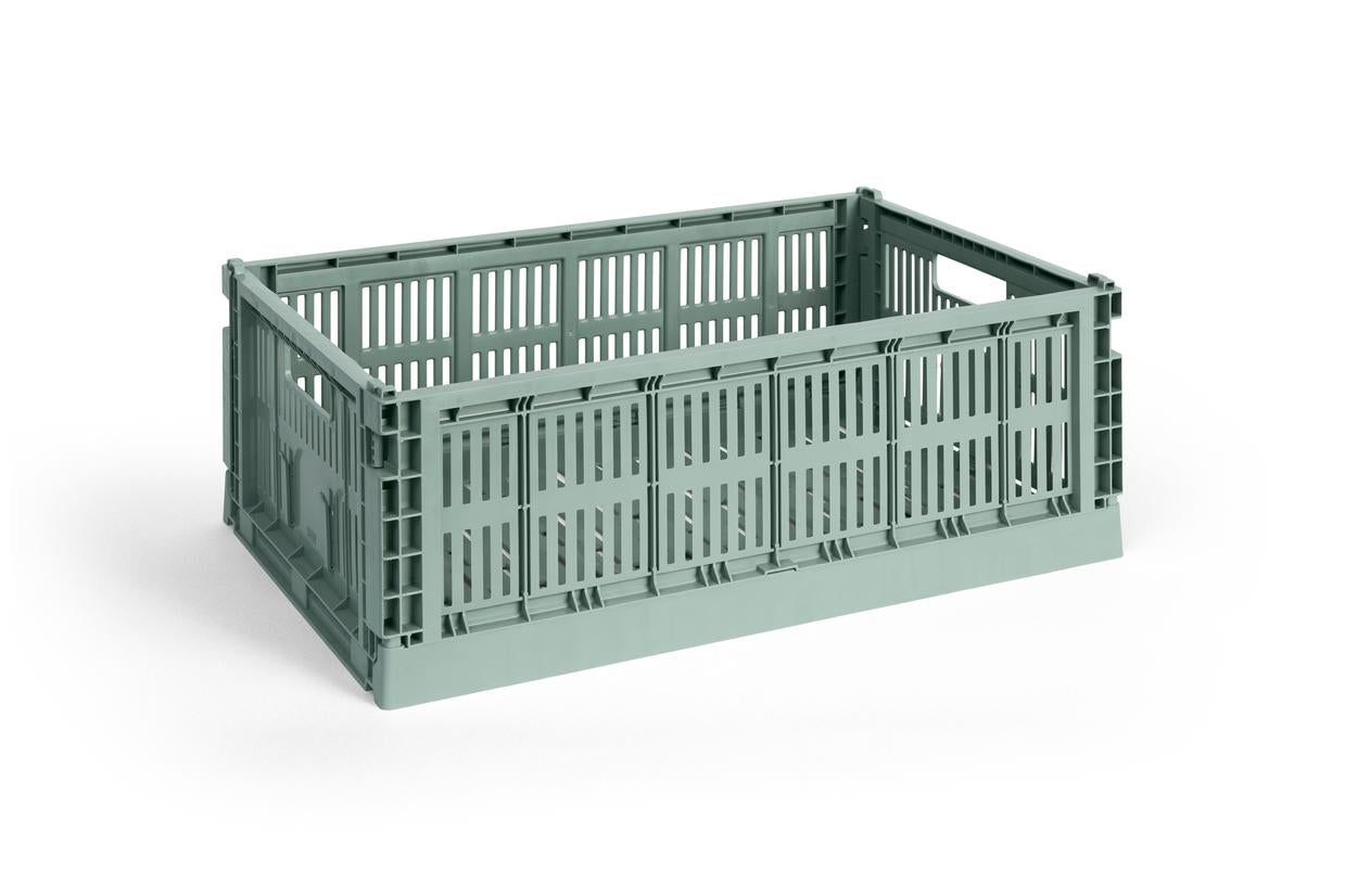 Green plastic crate on a white background