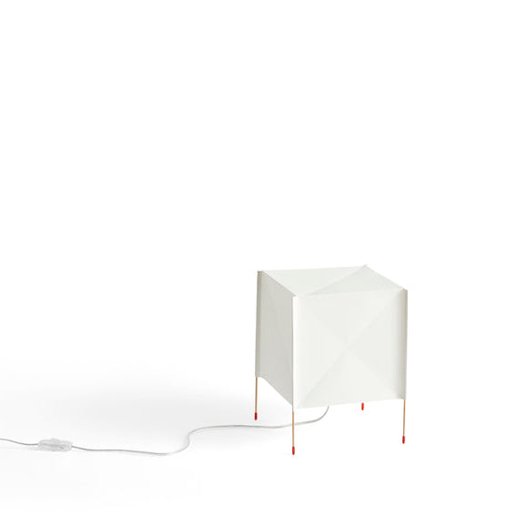 Modern white lamp with a geometric design on a white background
