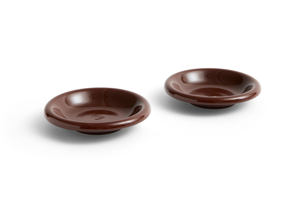 Two brown ceramic bowls on a white background