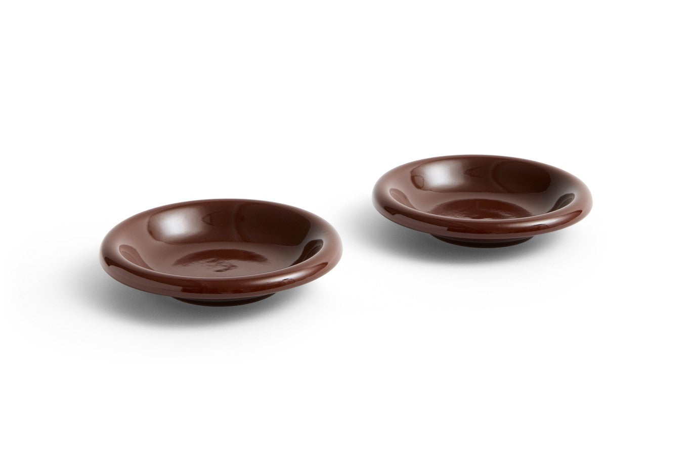 Two brown ceramic bowls on a white background