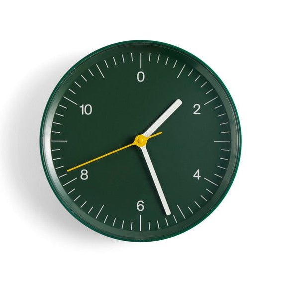 Green wall clock on white background