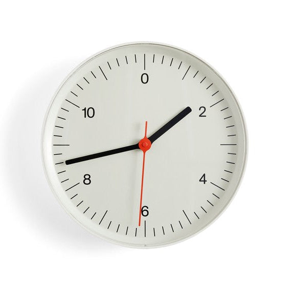 White wall clock on white background