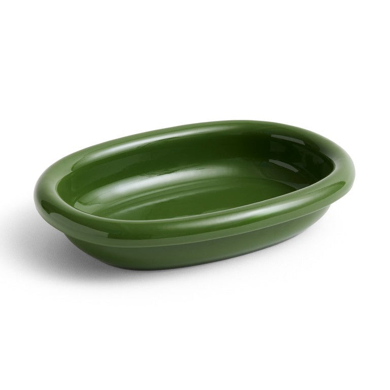 Green ceramic dish on a white background
