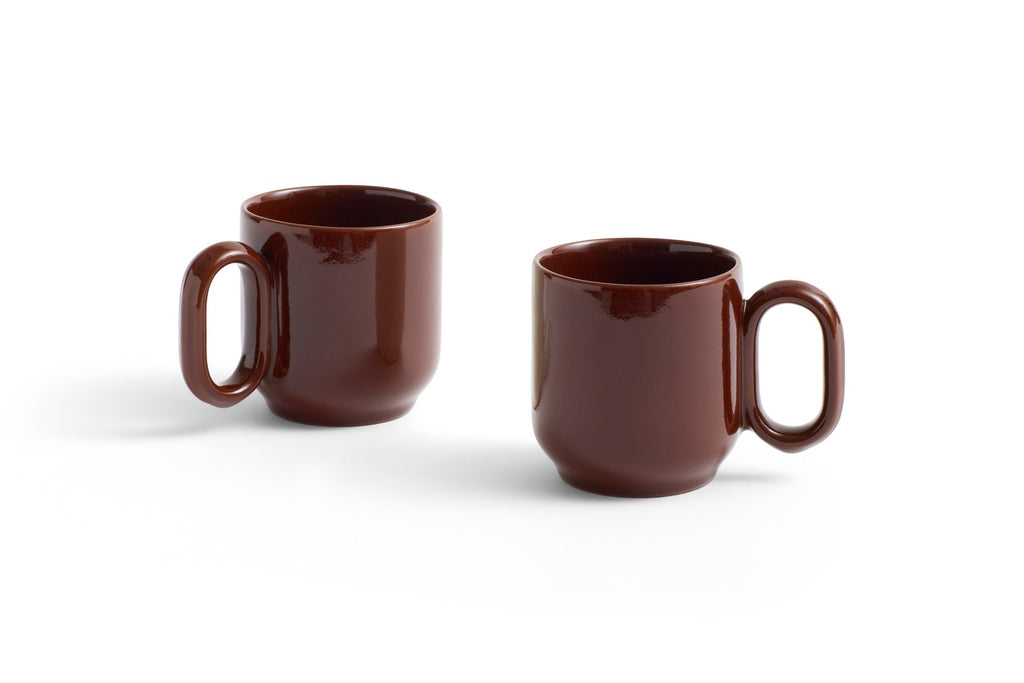 Two brown mugs on a white background