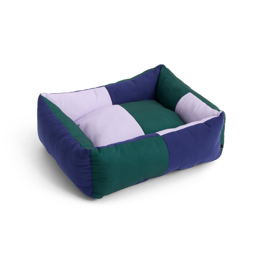 Pet bed with green and blue color scheme on a white background