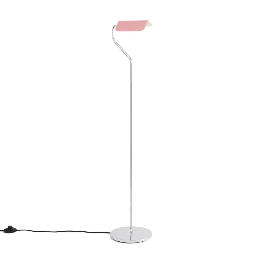 Modern floor lamp with pink shade on a white background