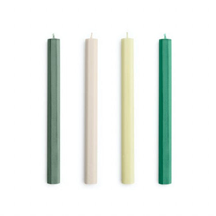 Four candles in different colors arranged vertically on a white background