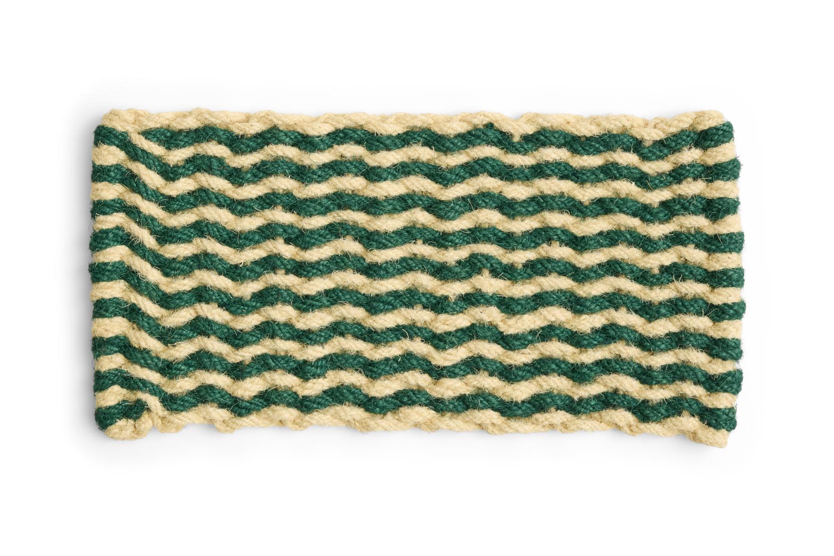 Door mat with green and beige wavy pattern on a white background