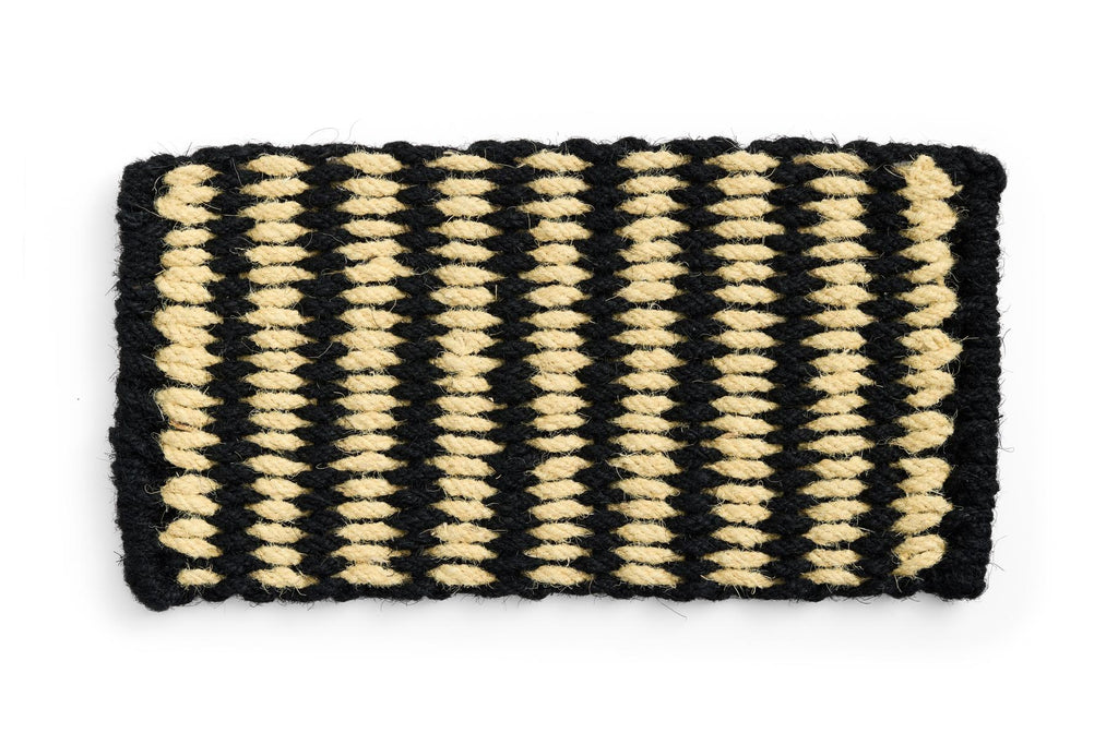 Black and beige striped woven mat on a white background