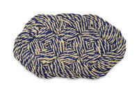 Woven mat with blue and beige pattern on a white background