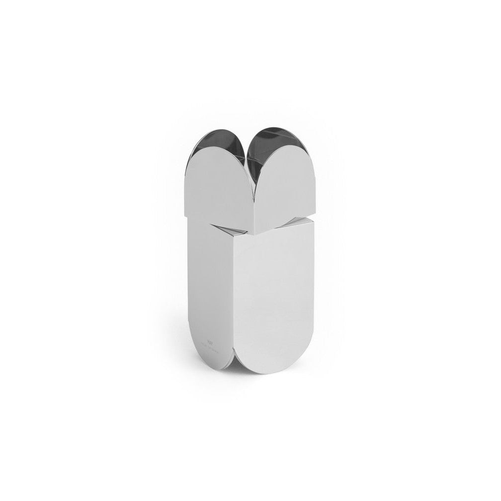 A polished silver metal object with a curved, capsule-like or butterfly-inspired silhouette, centered on a plain white background.
