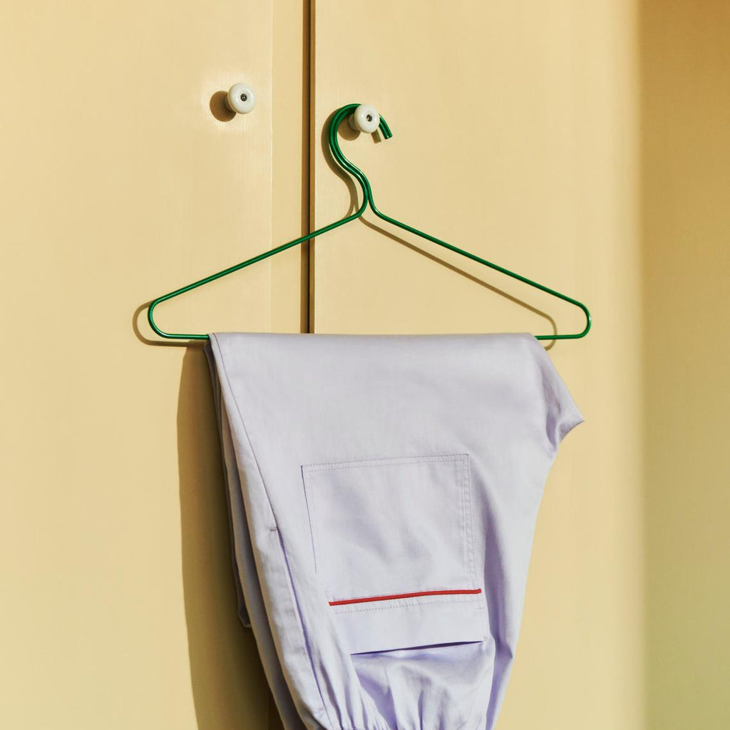 HAY Colour Hanger in Green with Brown PJ shirt hanging on green background