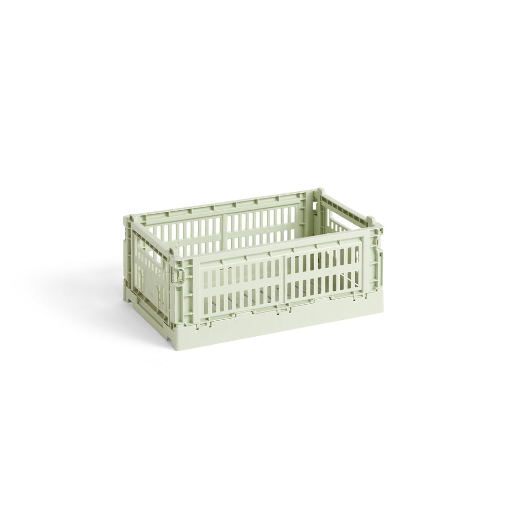 Light green plastic crate on a white background