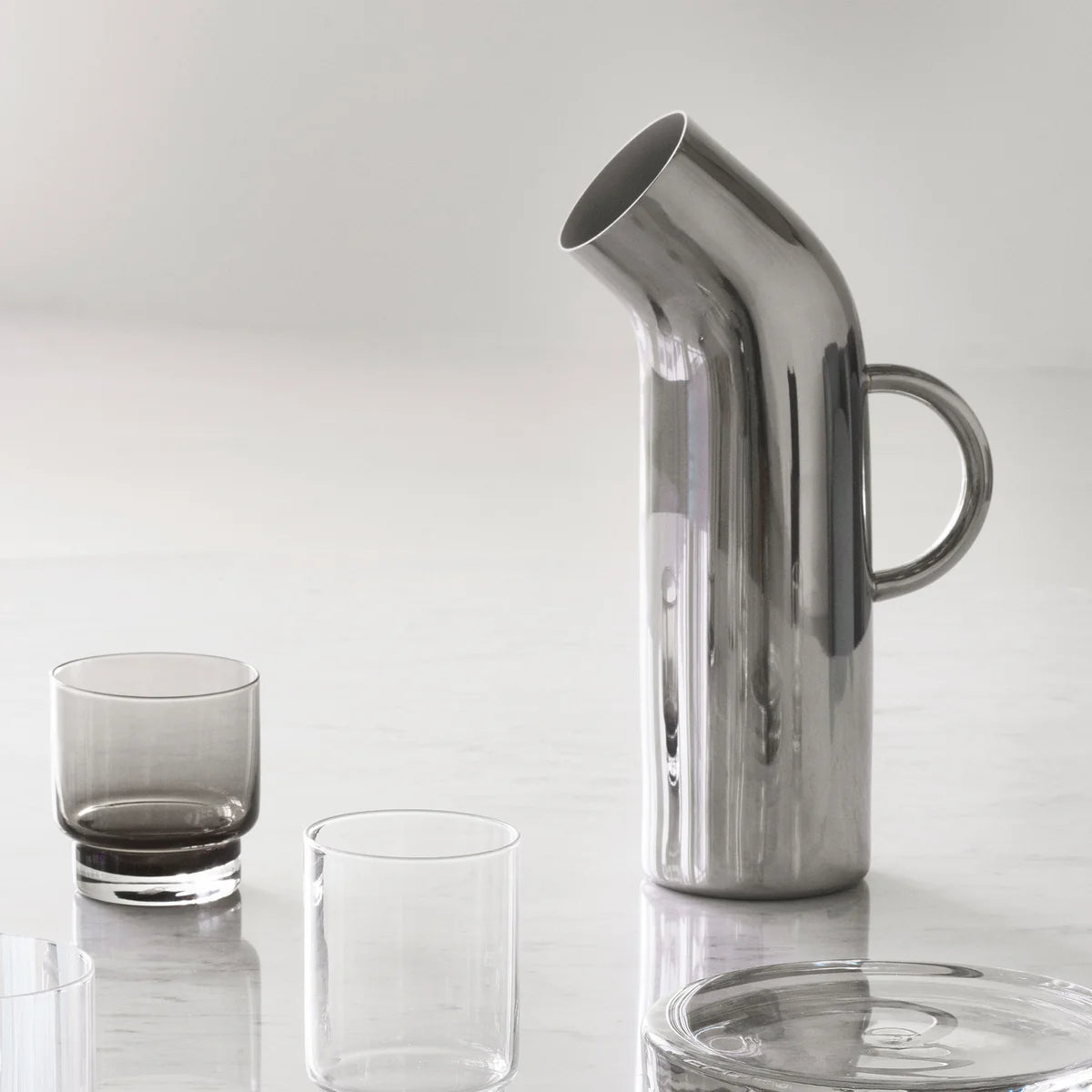 Stainless steel jug with two short glasses 